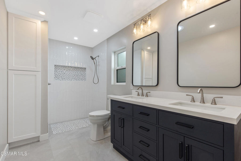 313 Raymond Street, Unit A Ojai, CA 93023 - Photo 14 of 32 a bathroom with a double vanity sink mirror and toilet