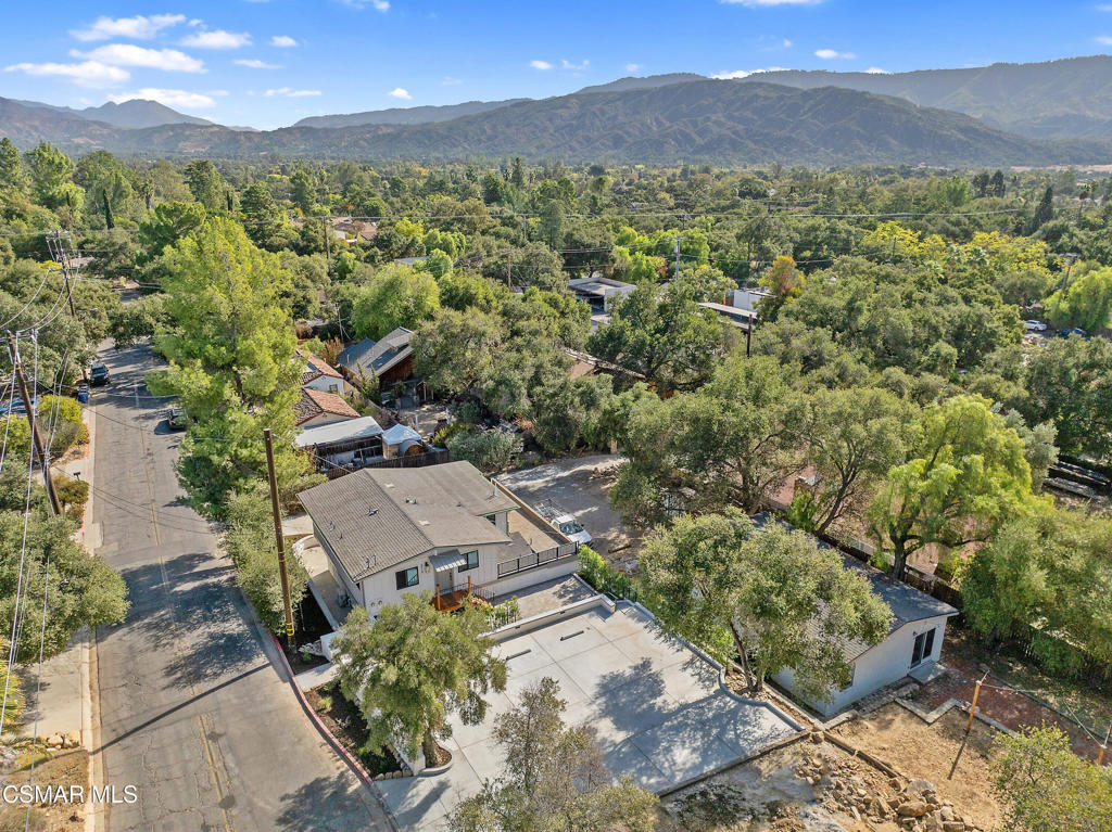 313 Raymond Street, Unit A Ojai, CA 93023 - Photo 23 of 32 an aerial view of a city with lots of residential buildings and mountain view in back