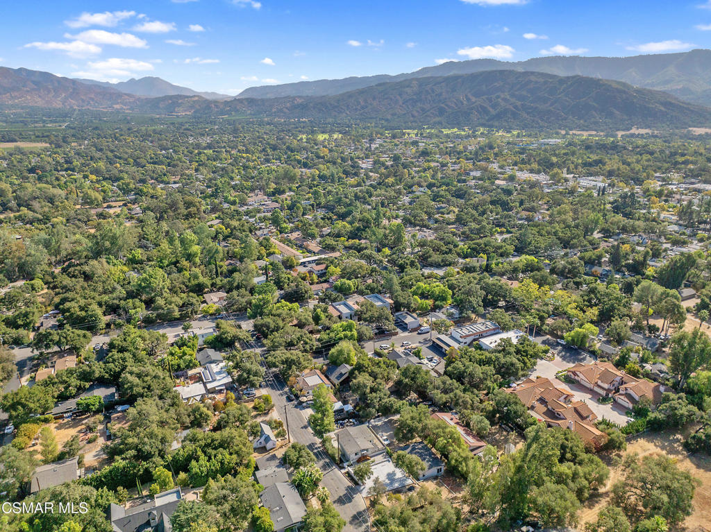 313 Raymond Street, Unit A Ojai, CA 93023 - Photo 25 of 32 a view of a lush green hillside and a building