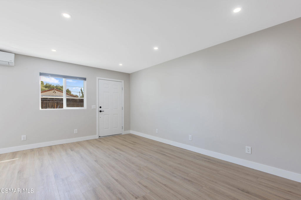313 Raymond Street, Unit A Ojai, CA 93023 - Photo 9 of 32 a view of empty room with wooden floor and window