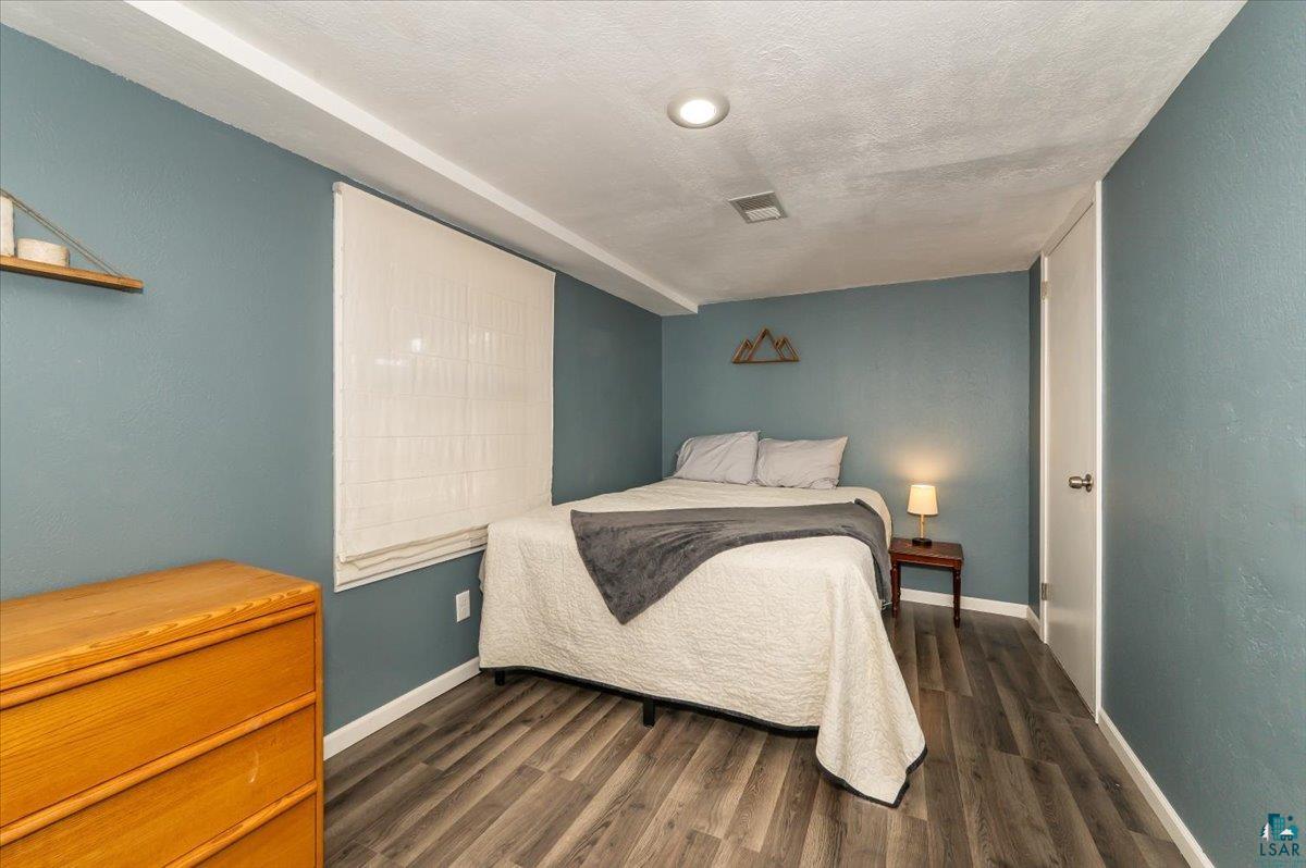 606 Maple Bend Drive Duluth, MN 55811 - Photo 17 of 30 Bedroom with dark wood-style flooring