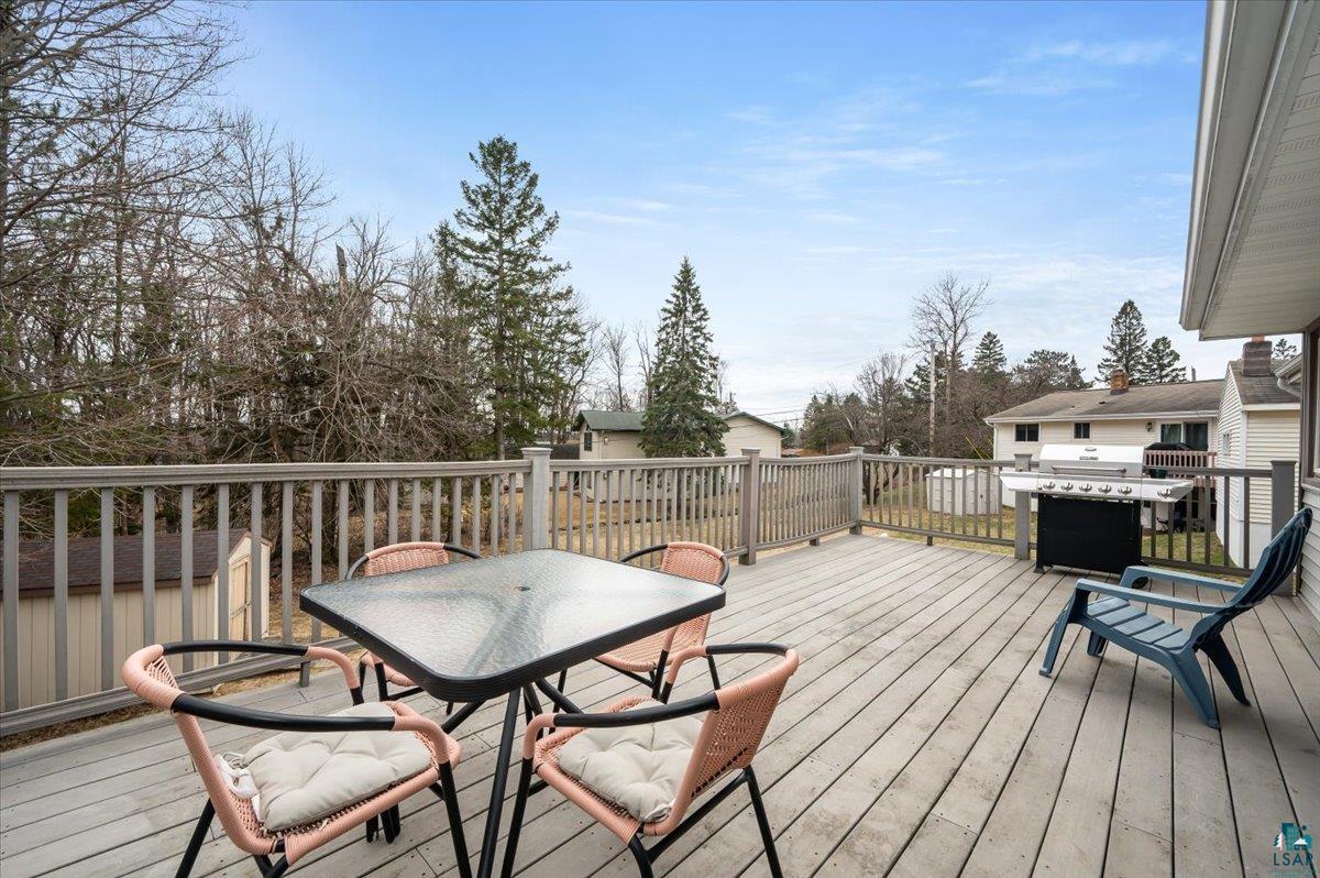 606 Maple Bend Drive Duluth, MN 55811 - Photo 24 of 30 Deck with area for grilling and outdoor dining area overlooking the backyard