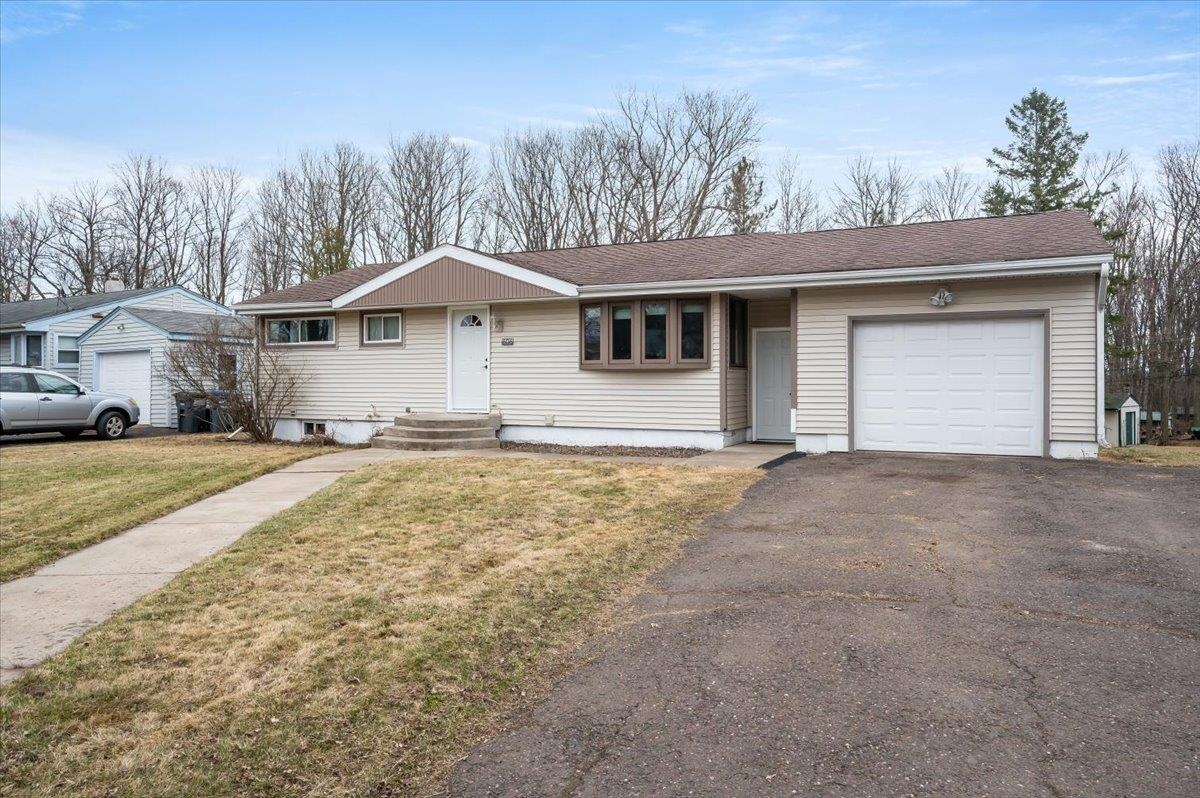 606 Maple Bend Drive Duluth, MN 55811 - Photo 26 of 30 Ranch-style house featuring a front yard, driveway, and an attached garage