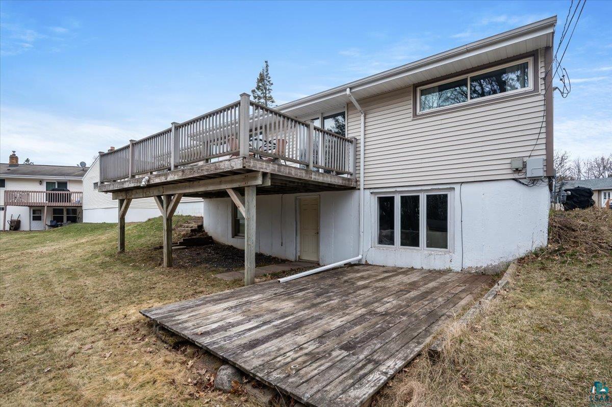 606 Maple Bend Drive Duluth, MN 55811 - Photo 30 of 30 Back of property featuring a deck and a yard