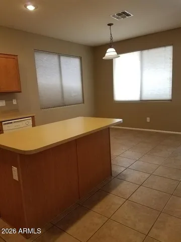 a bathroom with a sink a mirror and a window