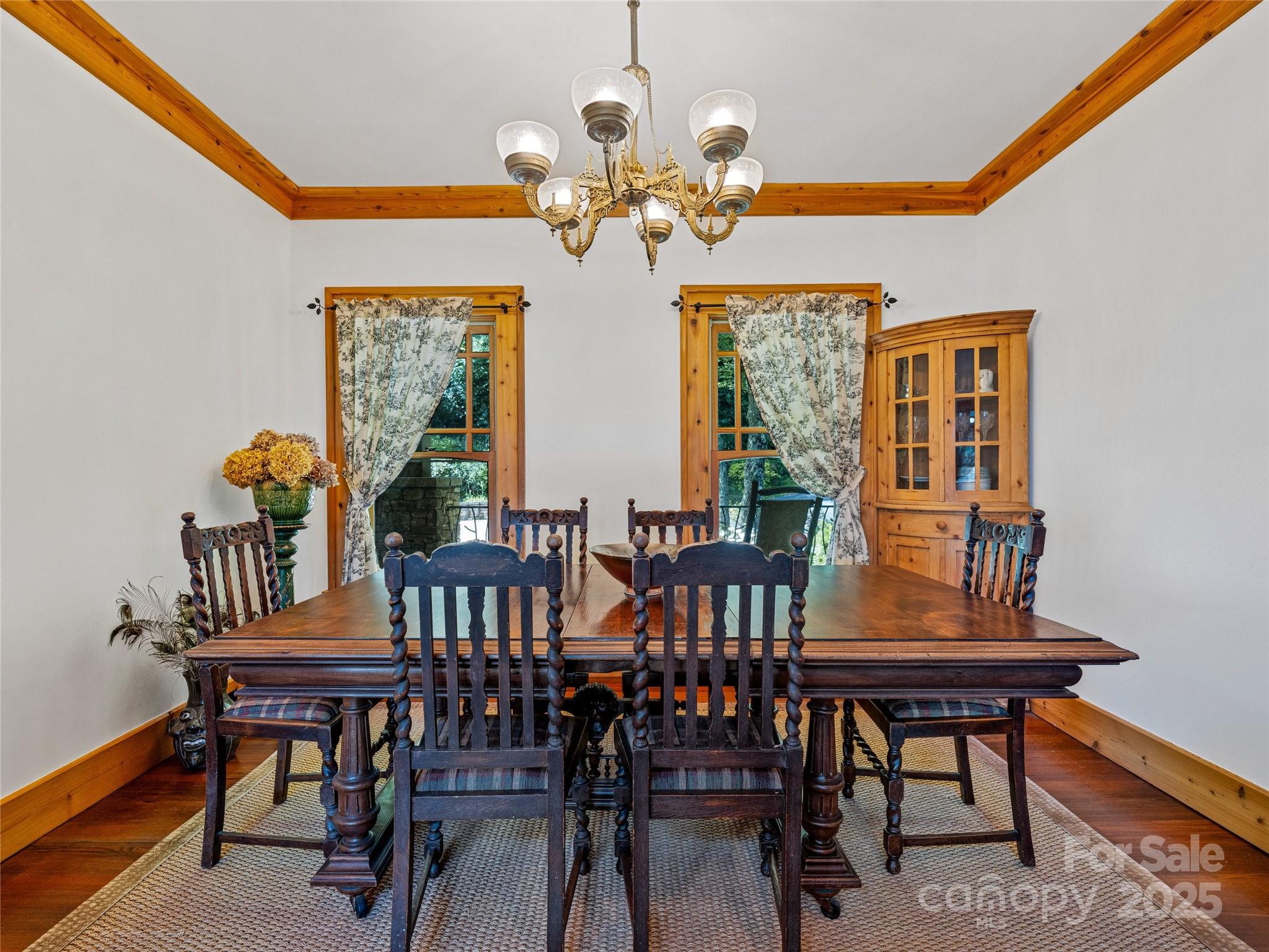 770 Mdw Rdg Drive Lake Toxaway, NC 28747 - Photo 12 of 48 a view of a dining room with furniture and a chandelier