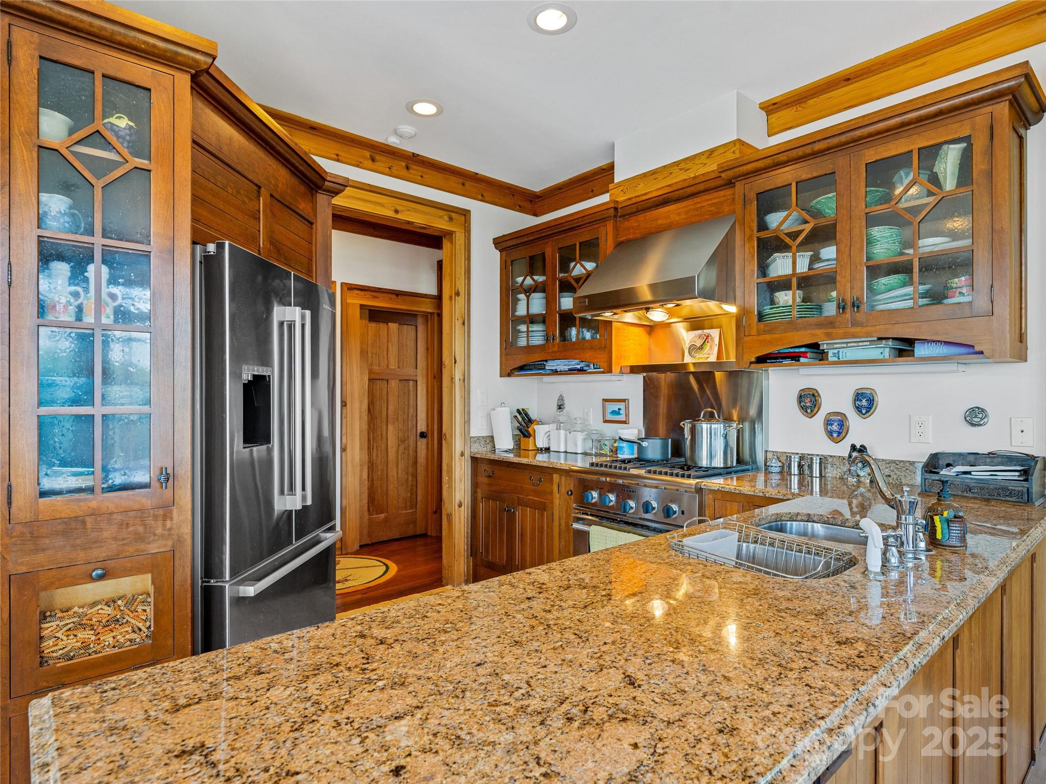 770 Mdw Rdg Drive Lake Toxaway, NC 28747 - Photo 13 of 48 a kitchen view of a kitchen island a stove a refrigerator and a sink