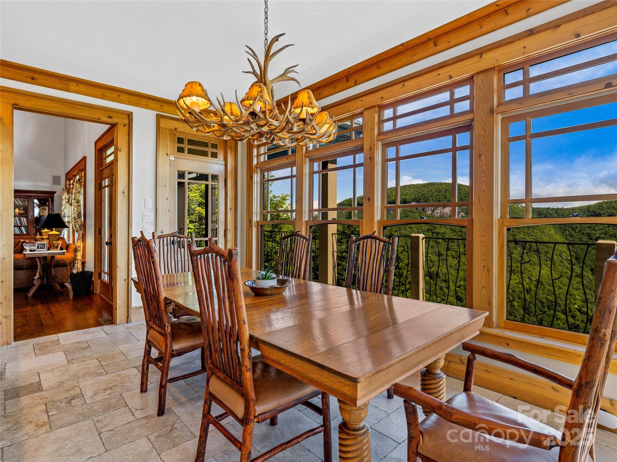 770 Mdw Rdg Drive Lake Toxaway, NC 28747 - Photo 16 of 48 a view of a patio with a table and chairs