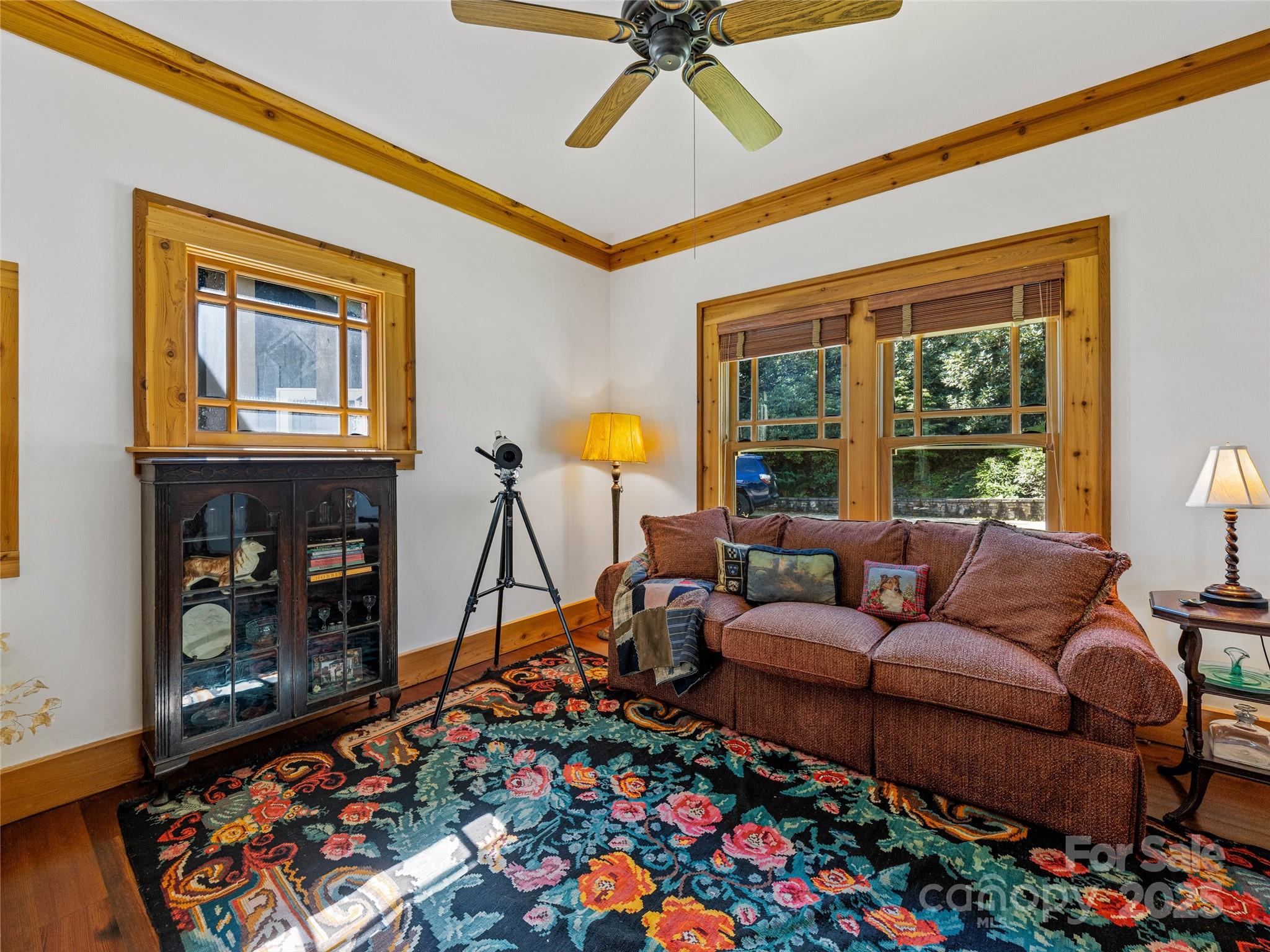 770 Mdw Rdg Drive Lake Toxaway, NC 28747 - Photo 18 of 48 a living room with furniture and a floor to ceiling window