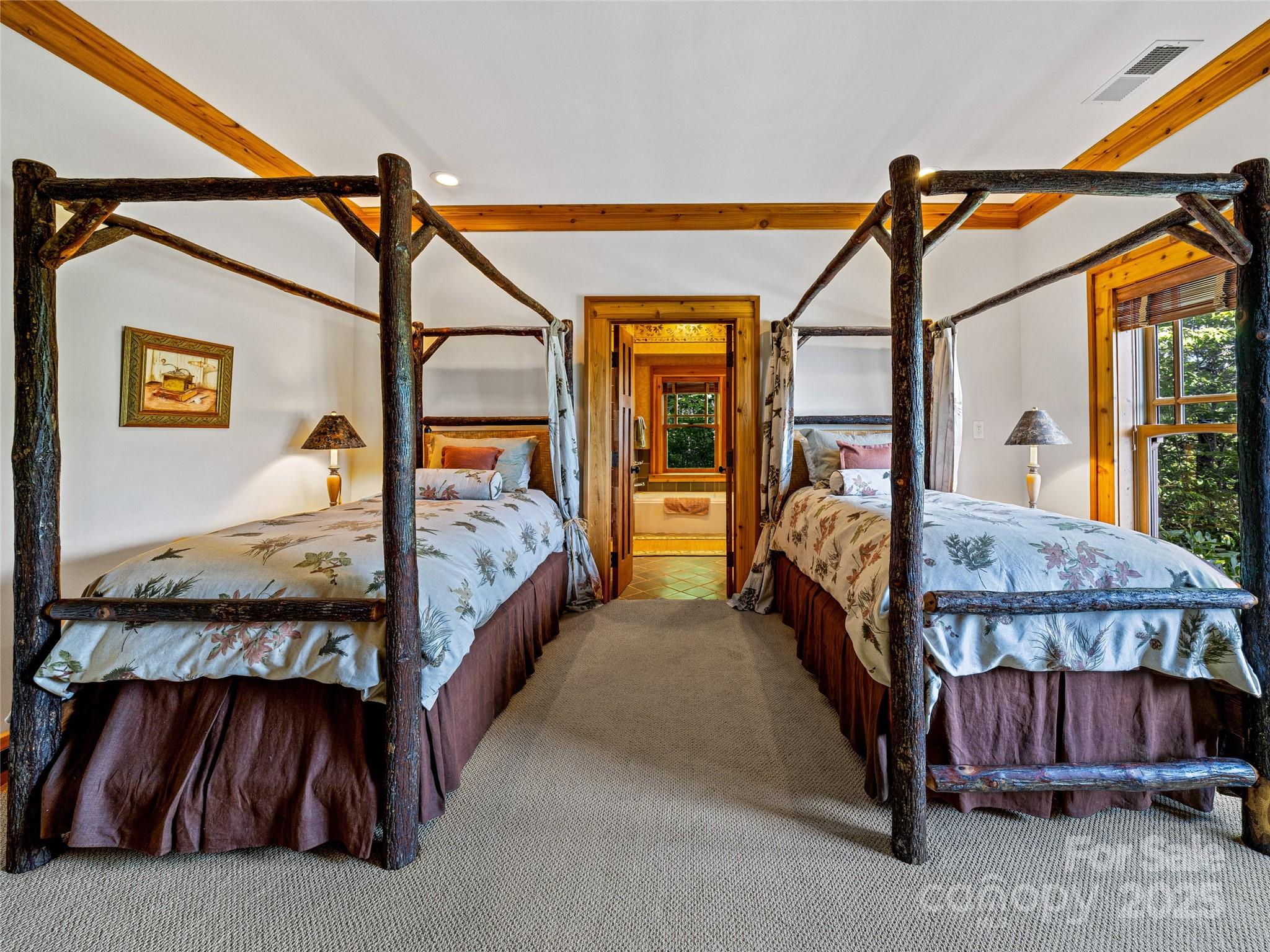 770 Mdw Rdg Drive Lake Toxaway, NC 28747 - Photo 34 of 48 a bedroom with furniture and window