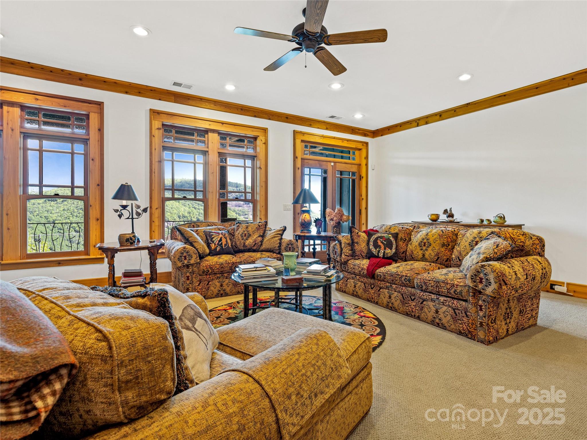 770 Mdw Rdg Drive Lake Toxaway, NC 28747 - Photo 36 of 48 a living room with furniture and a large window