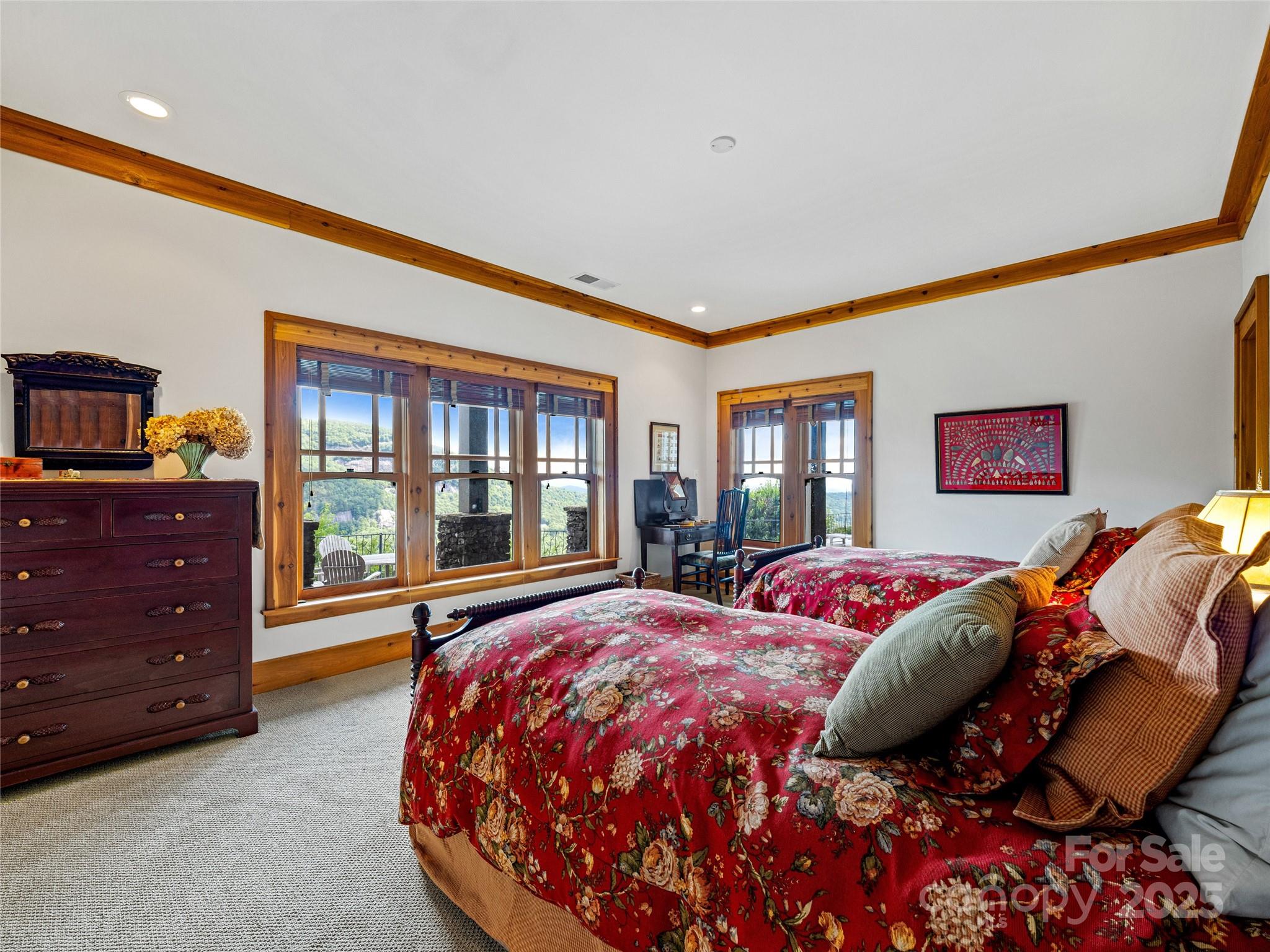 770 Mdw Rdg Drive Lake Toxaway, NC 28747 - Photo 38 of 48 a bed sitting in a bedroom next to a window