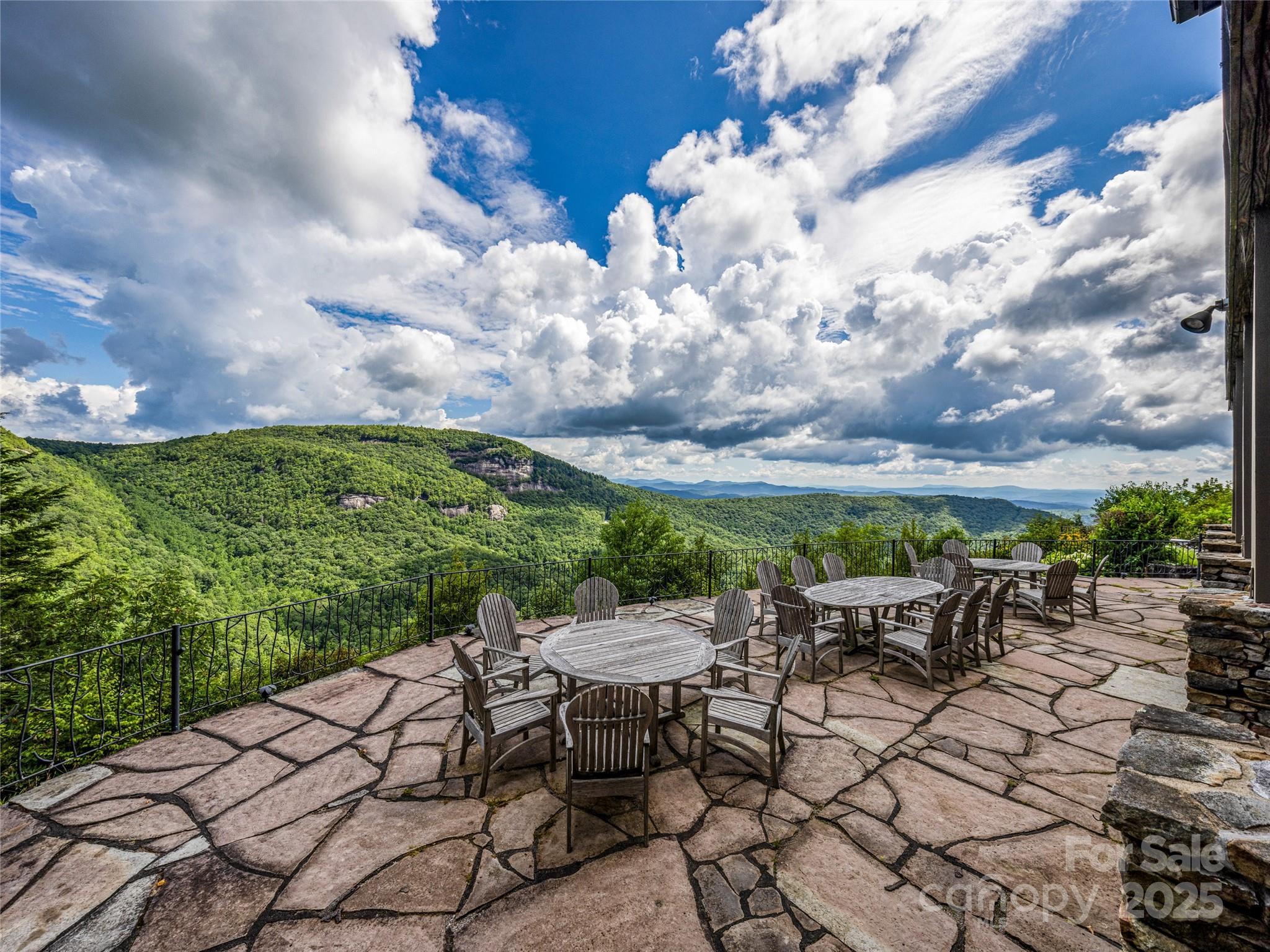 770 Mdw Rdg Drive Lake Toxaway, NC 28747 - Photo 40 of 48 a view of a chairs and table in patio