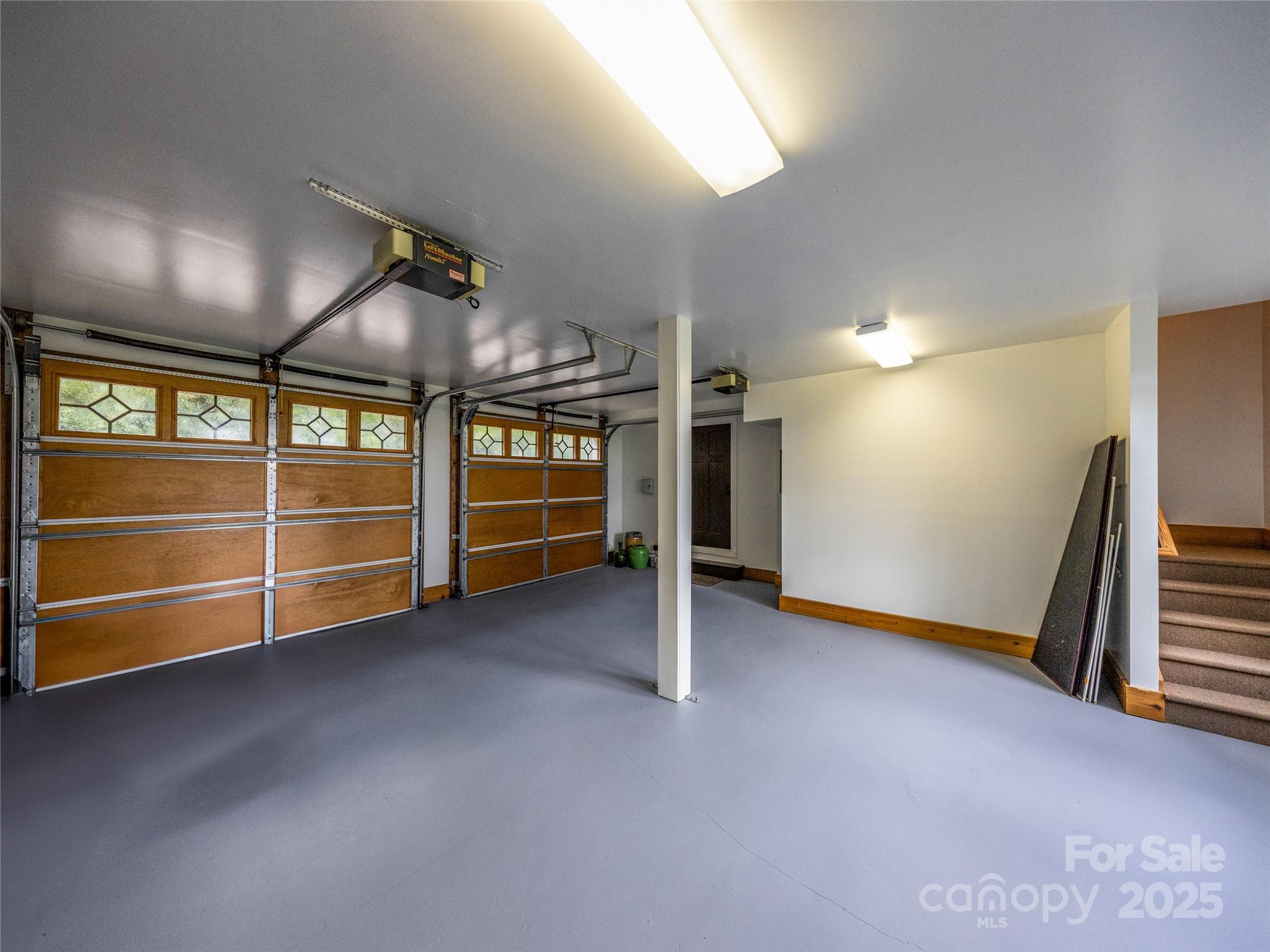 770 Mdw Rdg Drive Lake Toxaway, NC 28747 - Photo 47 of 48 a view of an empty room with a fireplace