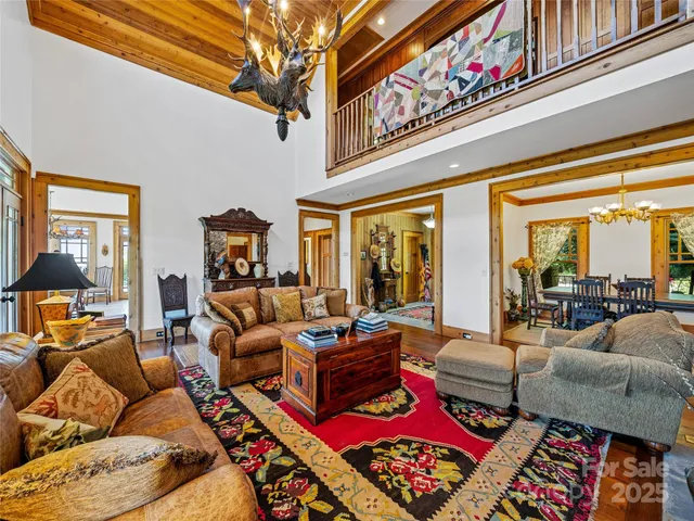 a kitchen view of a kitchen island a stove a refrigerator and a sink
