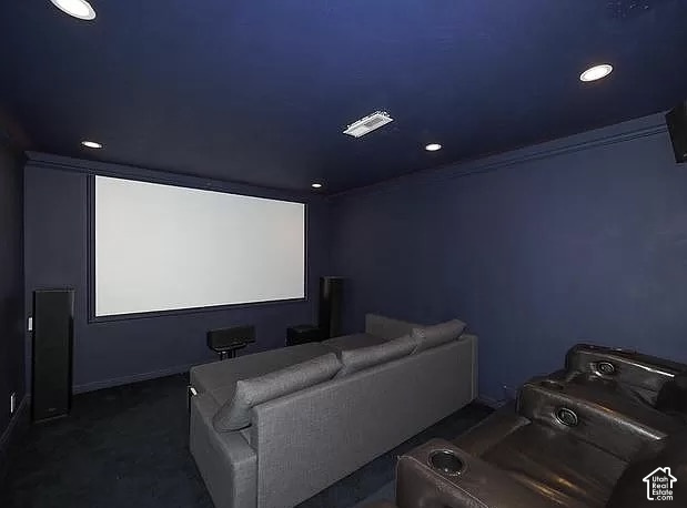 13548 South Villa Rosa Way Draper, UT 84020 - Photo 19 of 28 Dedicated media room featuring a large projection screen, recessed ceiling lighting, and dark wall finishes