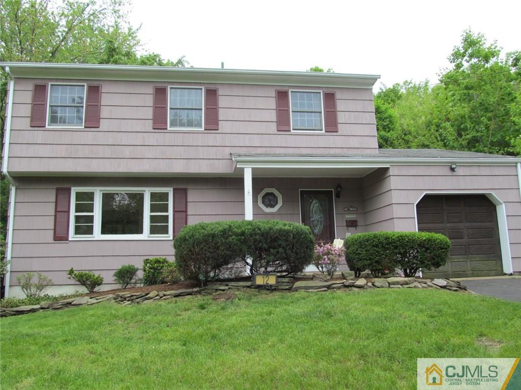 12 Kings Road East Brunswick, NJ 08816 - Photo 1 of 24 front view of a house with a yard