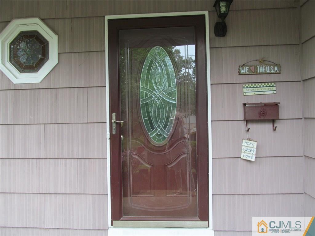 12 Kings Road East Brunswick, NJ 08816 - Photo 2 of 24 a close view of door lock
