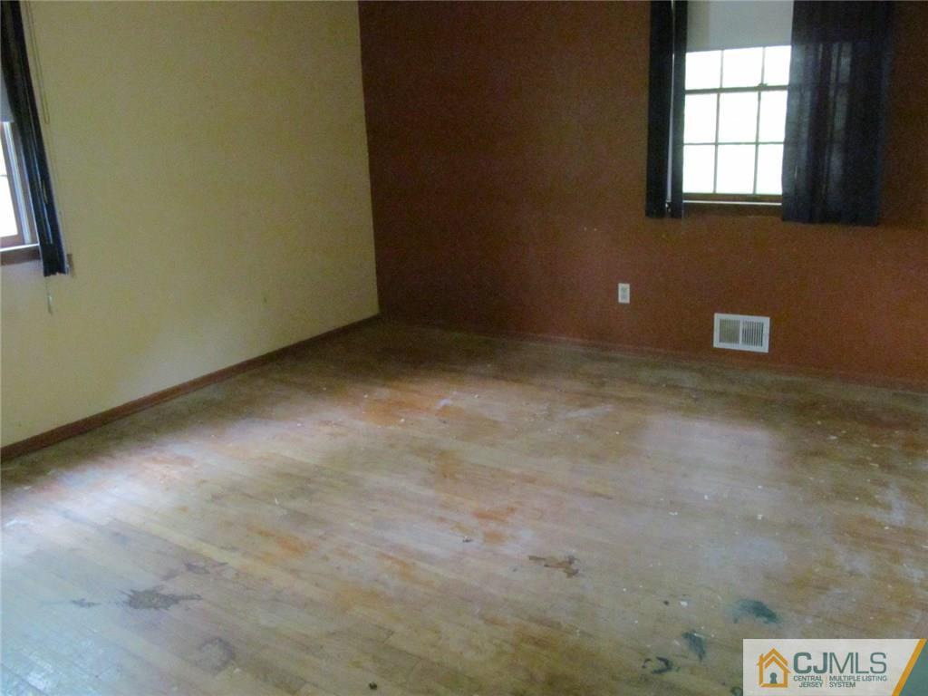12 Kings Road East Brunswick, NJ 08816 - Photo 14 of 24 a view of an empty room with a window