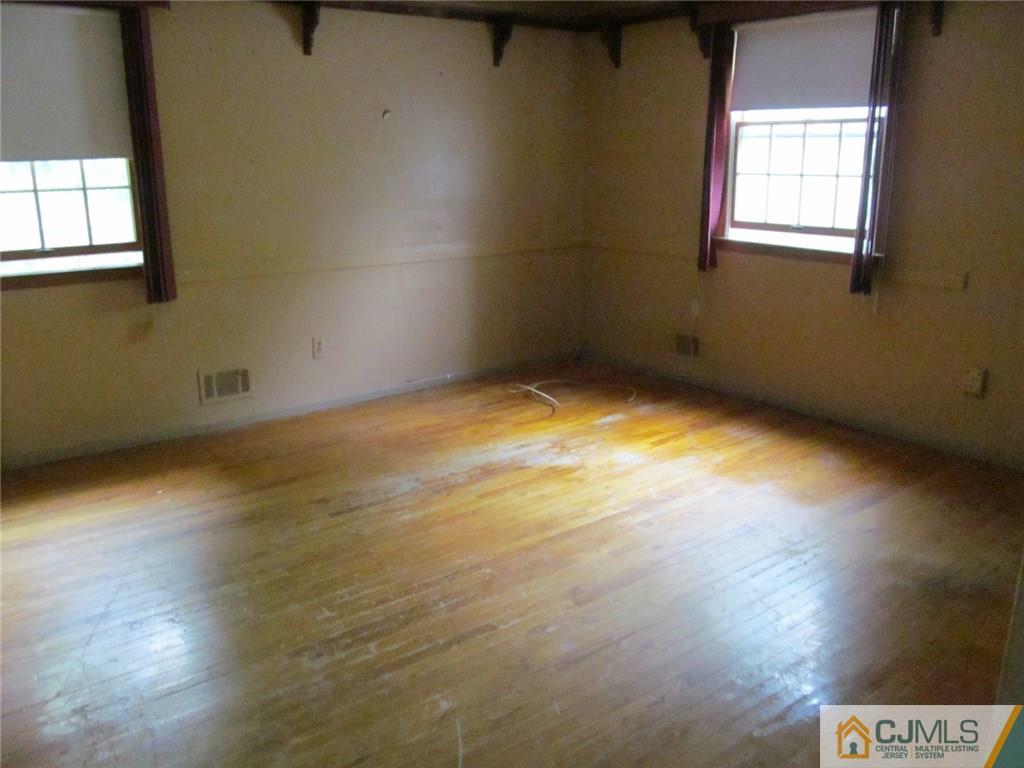 12 Kings Road East Brunswick, NJ 08816 - Photo 16 of 24 a view of an empty room and window