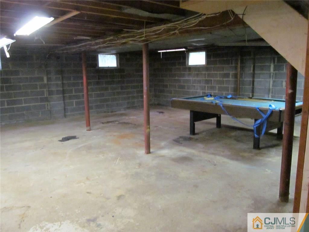 12 Kings Road East Brunswick, NJ 08816 - Photo 20 of 24 a view of an empty room with a wooden door