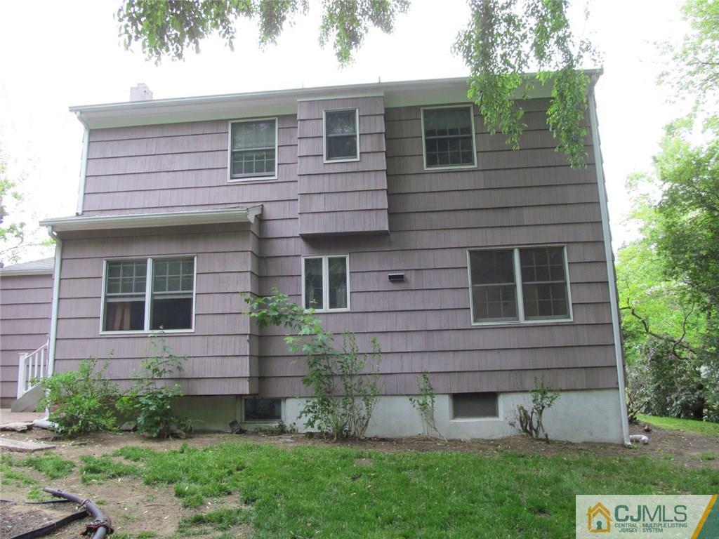 12 Kings Road East Brunswick, NJ 08816 - Photo 23 of 24 a view of a house with a yard and plants