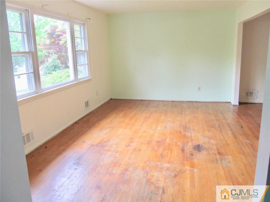 12 Kings Road East Brunswick, NJ 08816 - Photo 4 of 24 a view of an empty room with a window