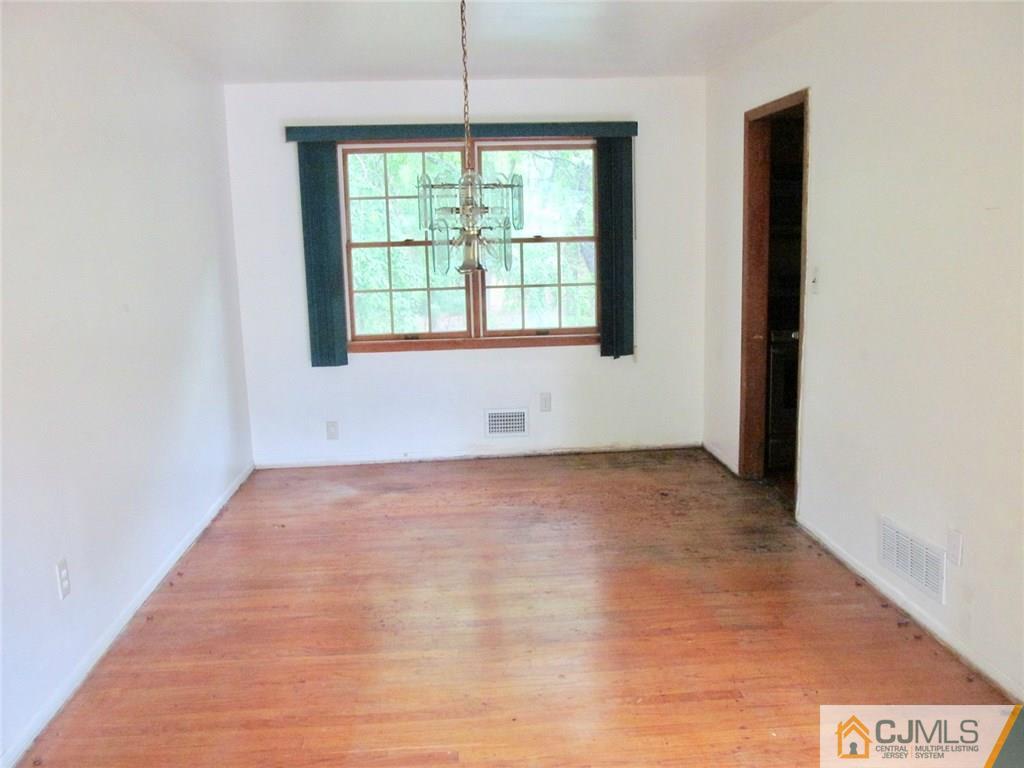 12 Kings Road East Brunswick, NJ 08816 - Photo 5 of 24 a view of an empty room with a window