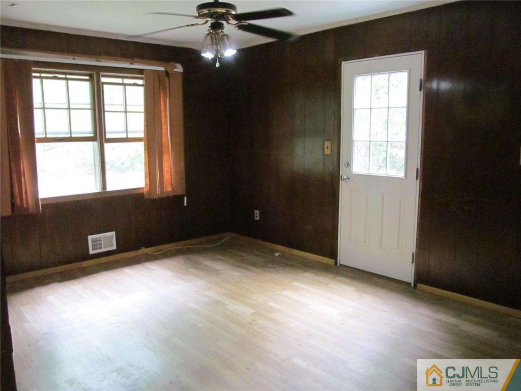 12 Kings Road East Brunswick, NJ 08816 - Photo 9 of 24 a view of an empty room with a window