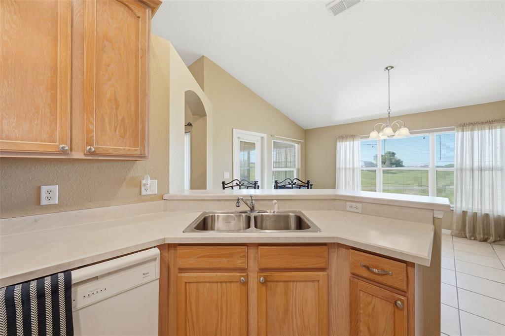 17083 Southeast 115th Terrace Road Summerfield, FL 34491 - Photo 15 of 61 a view with granite countertop a sink and a window