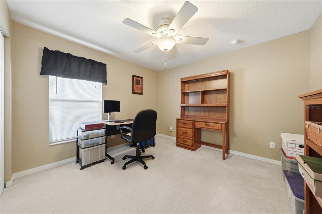 17083 Southeast 115th Terrace Road Summerfield, FL 34491 - Photo 30 of 61 a view of a workspace with furniture and a window
