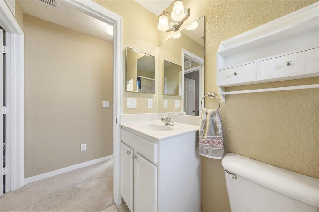 17083 Southeast 115th Terrace Road Summerfield, FL 34491 - Photo 33 of 61 a bathroom with a sink a toilet and shower