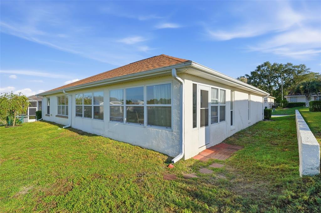 17083 Southeast 115th Terrace Road Summerfield, FL 34491 - Photo 39 of 61 a view of a house with backyard and garden