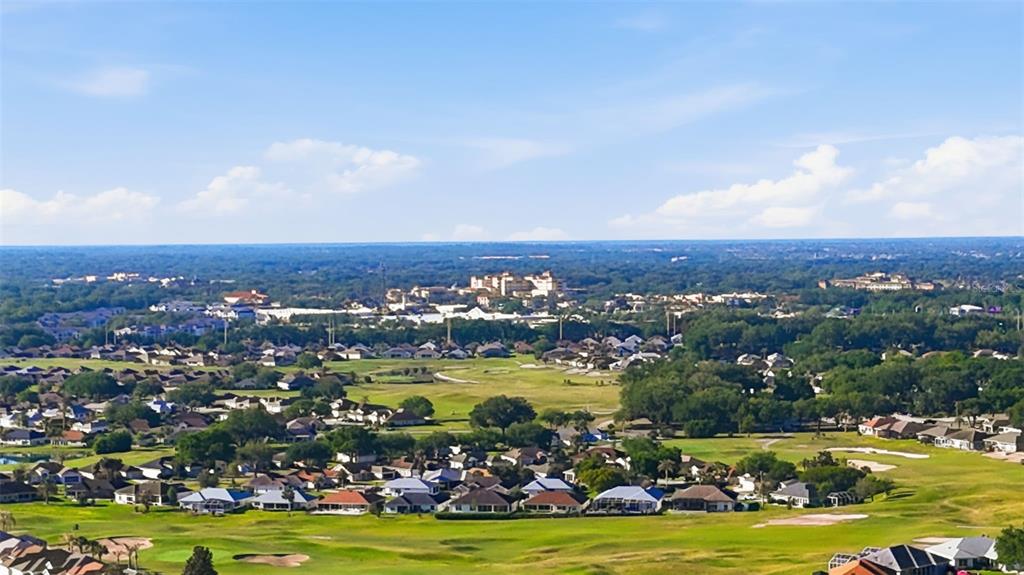 17083 Southeast 115th Terrace Road Summerfield, FL 34491 - Photo 48 of 61 an aerial view of a city with lots of residential buildings ocean and mountain view in back