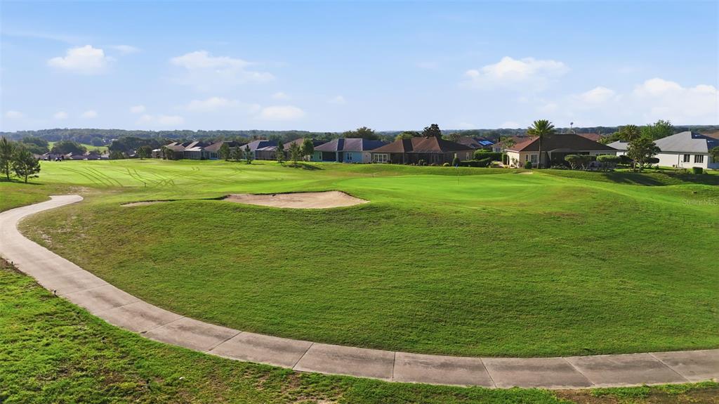 17083 Southeast 115th Terrace Road Summerfield, FL 34491 - Photo 49 of 61 a view of a golf course with a garden