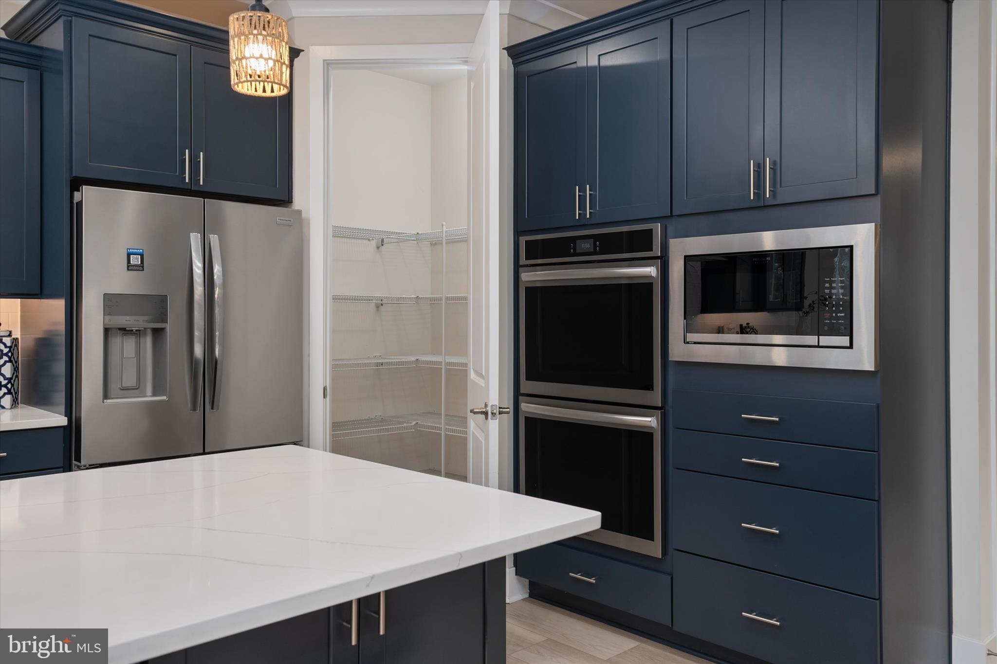 143 Stilly Way Annapolis, MD 21403 - Photo 11 of 60 a kitchen with a refrigerator and a stove top oven