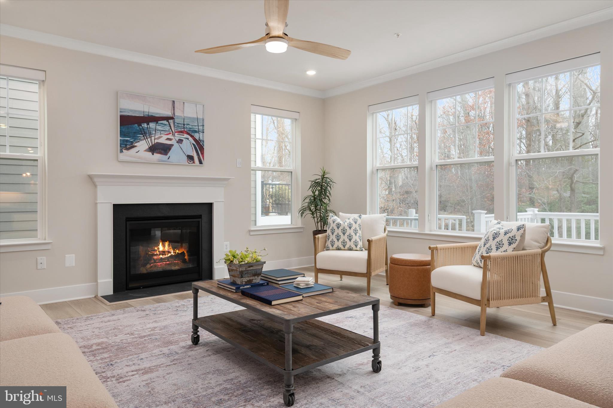143 Stilly Way Annapolis, MD 21403 - Photo 13 of 60 a living room with furniture a large window and a fireplace