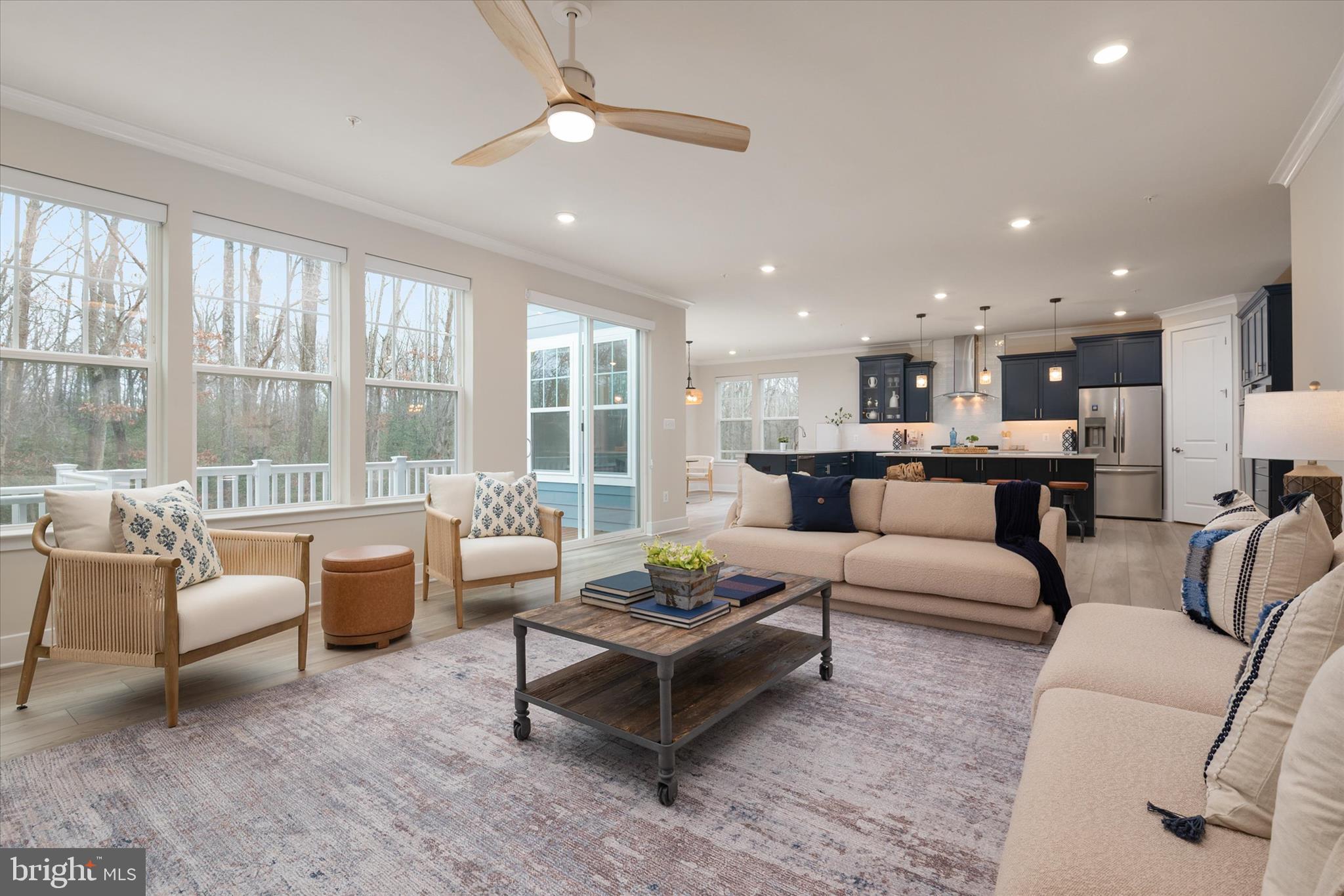 143 Stilly Way Annapolis, MD 21403 - Photo 14 of 60 a living room with furniture and a large window with kitchen view