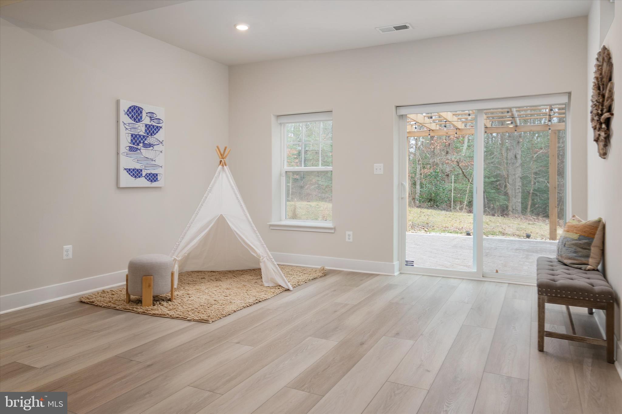143 Stilly Way Annapolis, MD 21403 - Photo 41 of 60 a view of empty room with wooden floor and fan