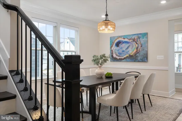 a front view of a house with a tree