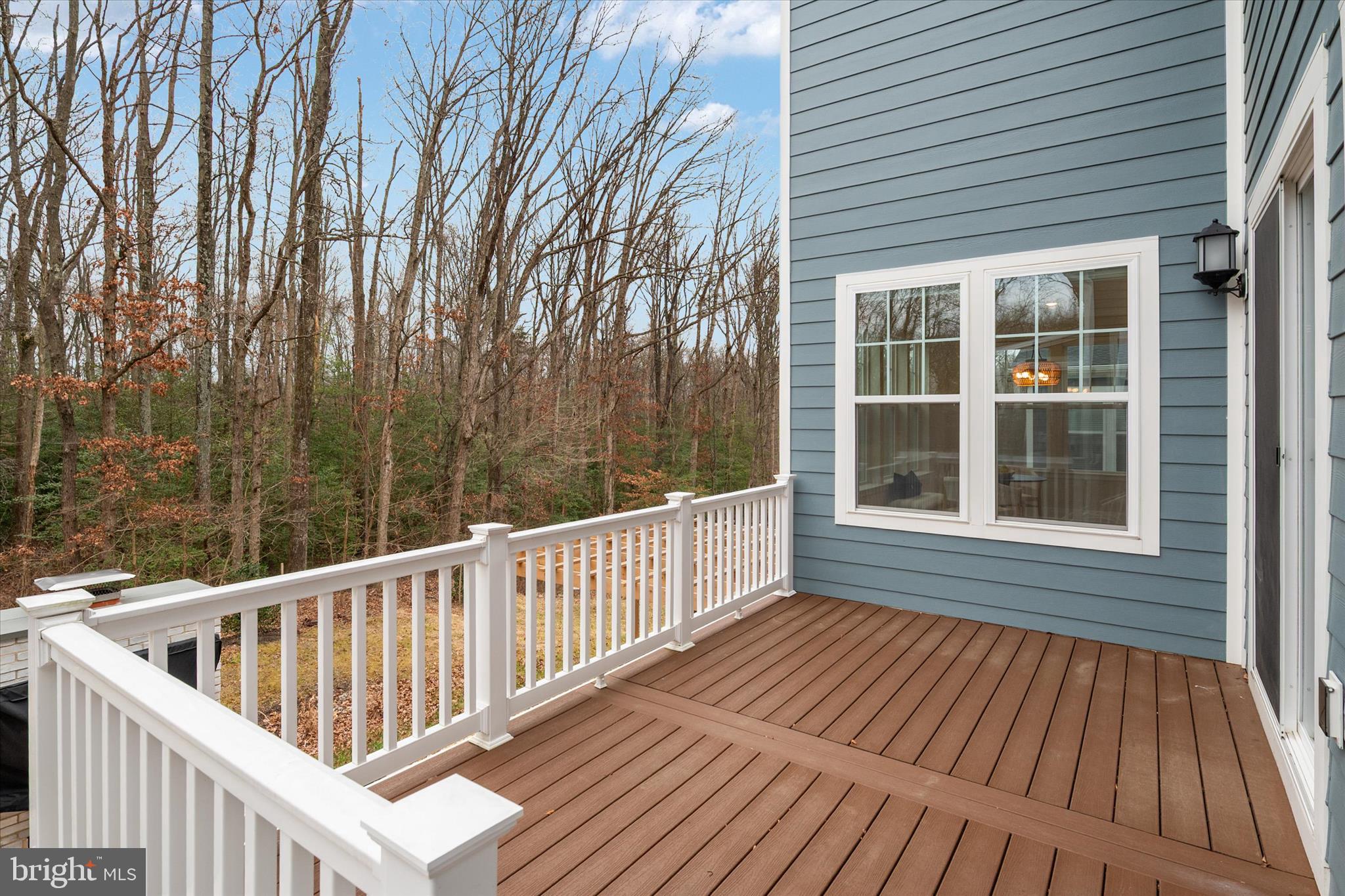 143 Stilly Way Annapolis, MD 21403 - Photo 52 of 60 a view of a wooden deck with large trees