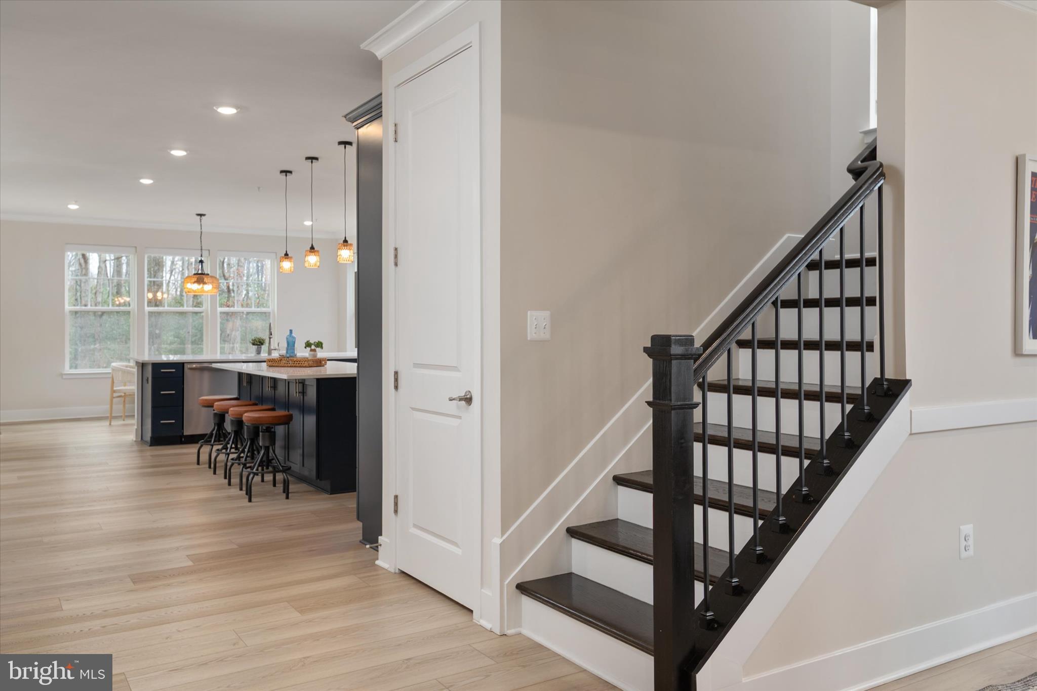 143 Stilly Way Annapolis, MD 21403 - Photo 6 of 60 a view of a hallway with dining room and chandelier