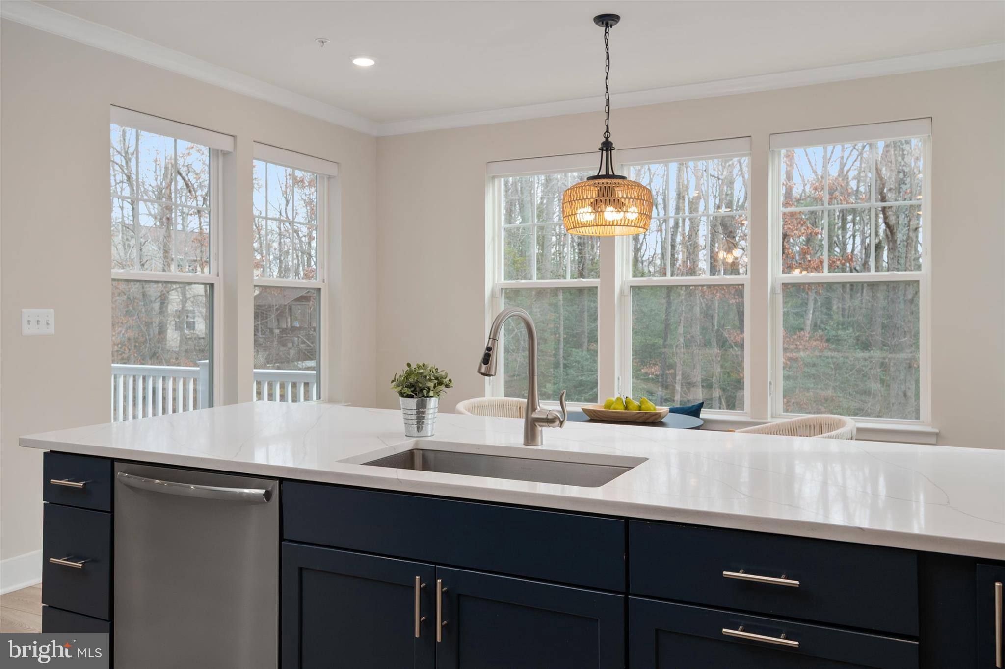 143 Stilly Way Annapolis, MD 21403 - Photo 9 of 60 a dining room with a window and a chandelier