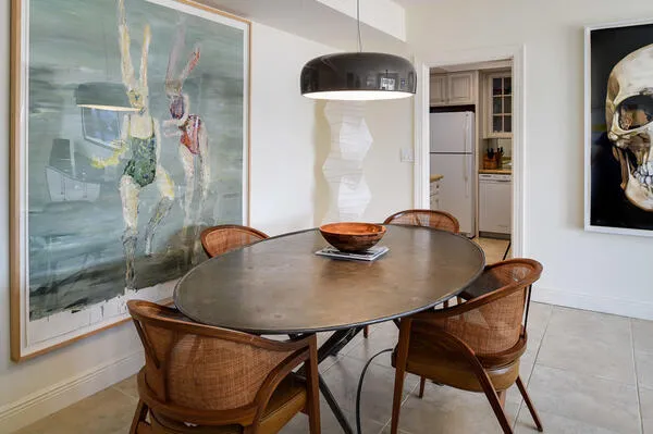 a dining room with furniture and window