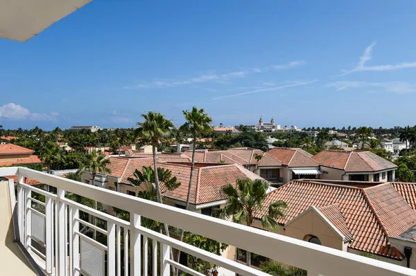 a view of a balcony with wooden floor and city view