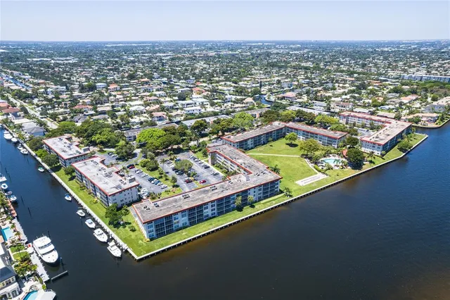 an aerial view of residential house with outdoor space and river