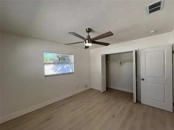 a spacious bathroom with a double vanity sink and a mirror