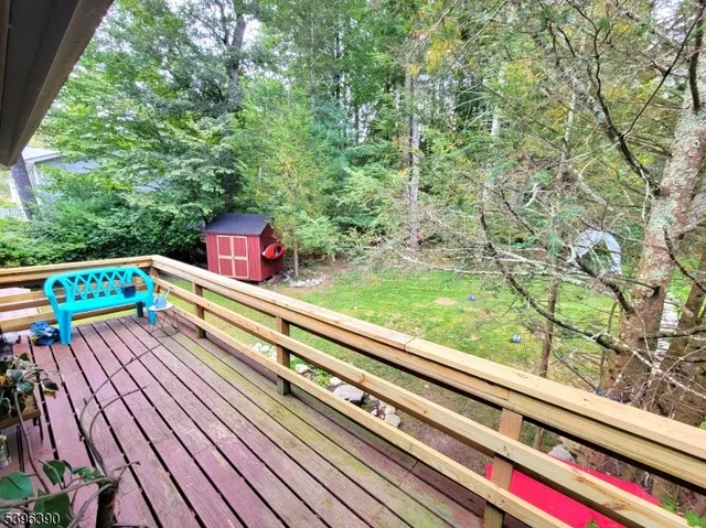a view of staircase with furniture and a potted plant