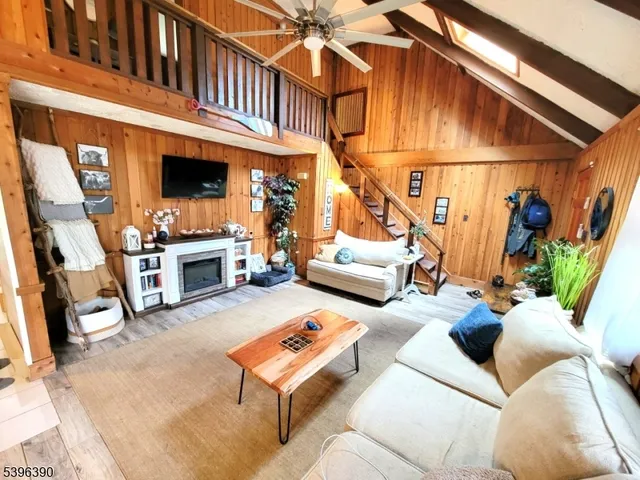 a dining room with furniture and a window
