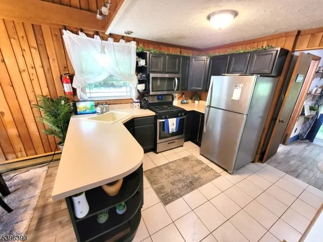 a bedroom with furniture and a large window